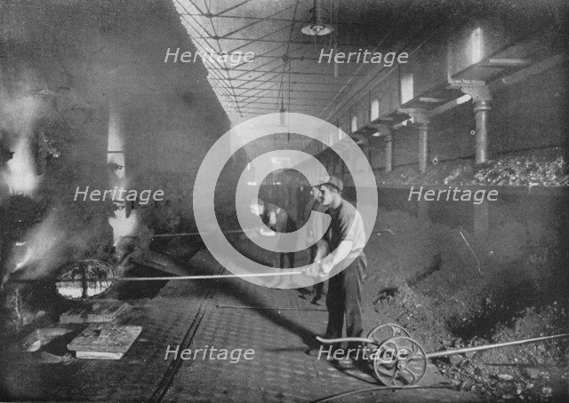 Drawing retorts by hand, South Metropolitan Gasworks, Peckham, London, 1903 (1903). Artist: Unknown.