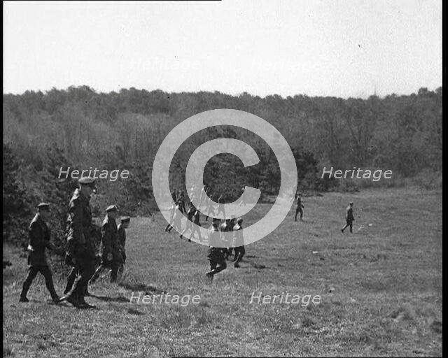 American Police Officers Searching the Area Outside American Aviator Charles Augustus..., 1930s. Creator: British Pathe Ltd.