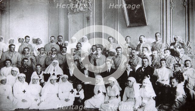 Tsarina Maria Fyodorovna of Russia visiting a hospital in Kiev, 1915. Artist: Unknown