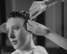 A Woman Having Her Hair Cut in the 'Victory' Style, 1942. Creator: British Pathe Ltd.