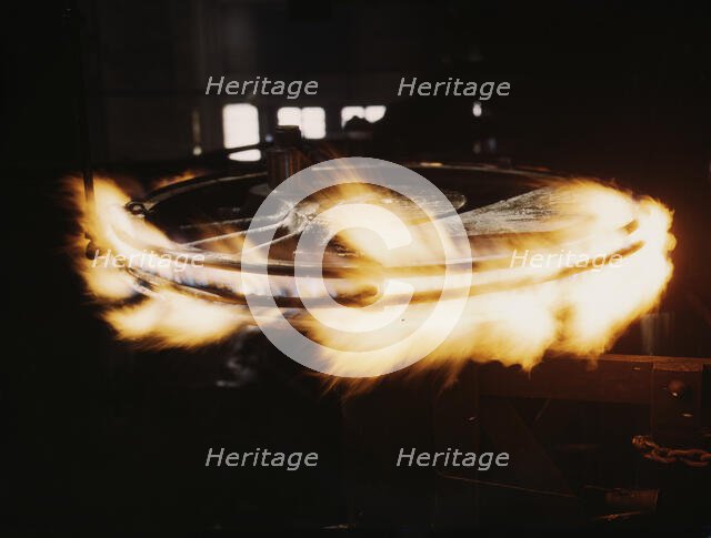 Retiring a locomotive driver wheel, Shopton, Iowa, 1943. Creator: Jack Delano.
