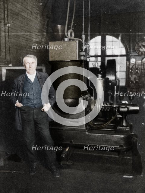 Thomas Alva Edison, American inventor, with his first dynamo for producing electric light, 1880s. Artist: Unknown.