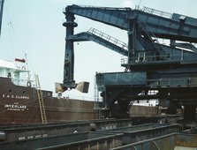 Pennsylvania R.R. ore docks, unloading ore from a lake freighter..., Cleveland, Ohio, 1943. Creator: Jack Delano.