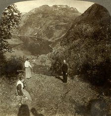 'Haying on mountain shelf high above Marok village and mirror-clear Geirangerfjord, Norway', c1905 Creator: Unknown.