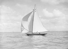 The 7 Metre yacht 'Pinaster' (K8) sailing with spinnaker, 1912. Creator: Kirk & Sons of Cowes.