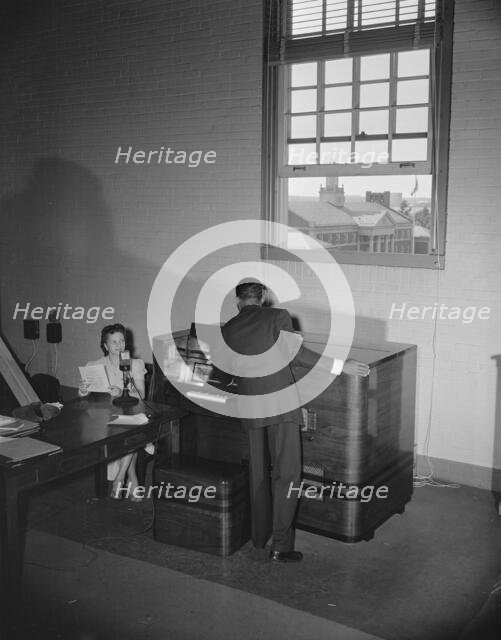 Broadcast tower at Howard University during commencement exercises, Washington, D.C, 1942. Creator: Gordon Parks.