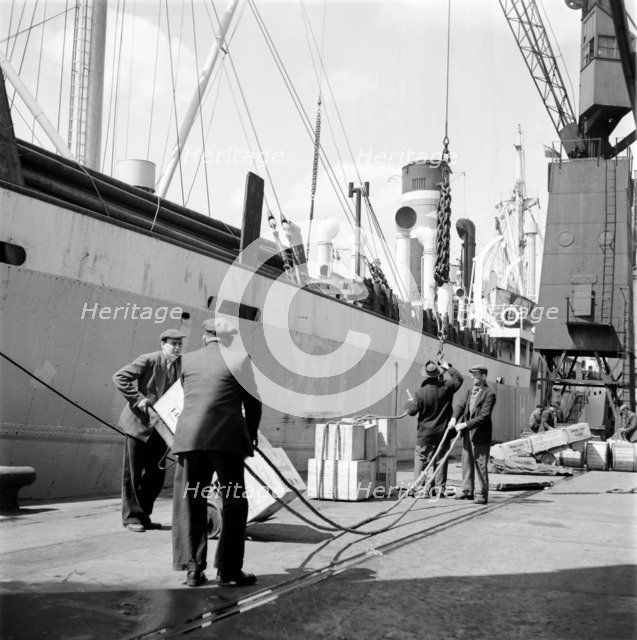Loading a ship at the North Quay, West India Docks, London, c1945-c1965. Artist: SW Rawlings