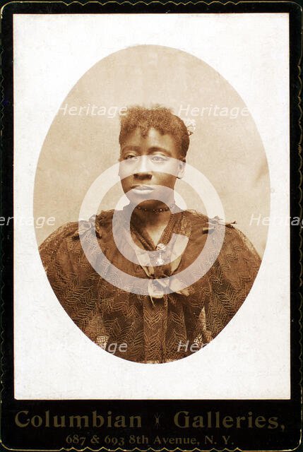 Woman wearing dress covered with lace across the bodice, c1890-c1899. Creator: Columbian Galleries.