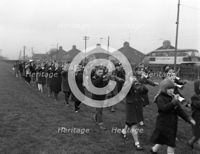 Children marching with home made bugles, Middlesborough, Teesside,1964.  Artist: Michael Walters