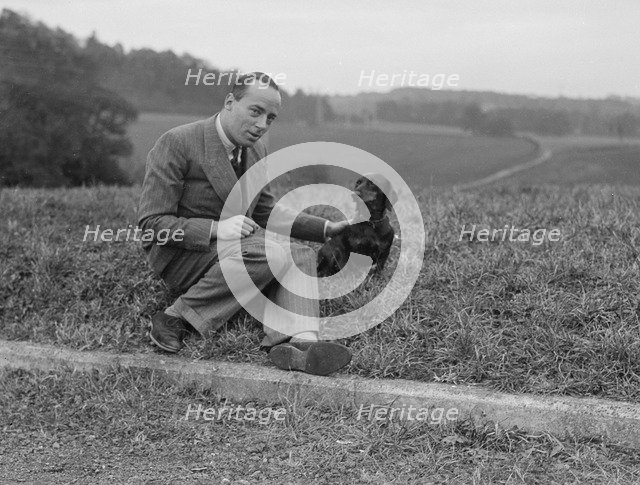 British racing driver Charles Mortimer and his pet dachshund, c1930s Artist: Bill Brunell.