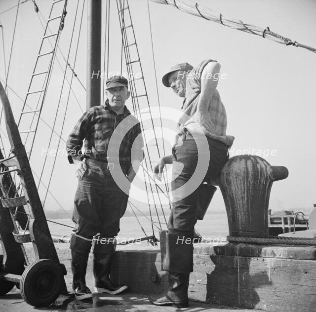 New England fishermen resting on the Fulton docks, New York, 1943. Creator: Gordon Parks.
