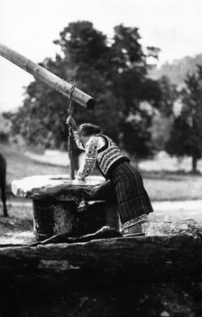 Woman getting water from a well, Bistrita Valley, Moldavia, north-east Romania, c1920-c1945. Artist: Adolph Chevalier