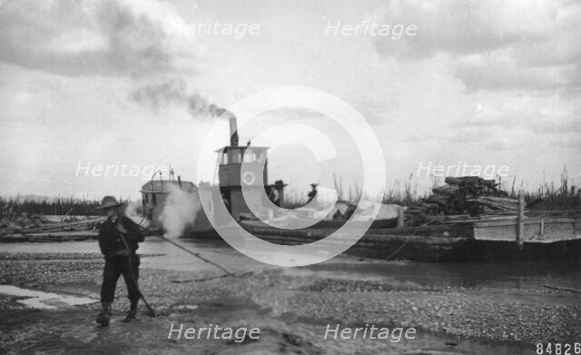 Steamer Little Delta and barge on sand bar, between c1900 and c1930. Creator: Unknown.