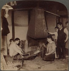 'A Japanese blacksmith at his forge, Yokohama, Japan', 1904. Artist: Unknown.