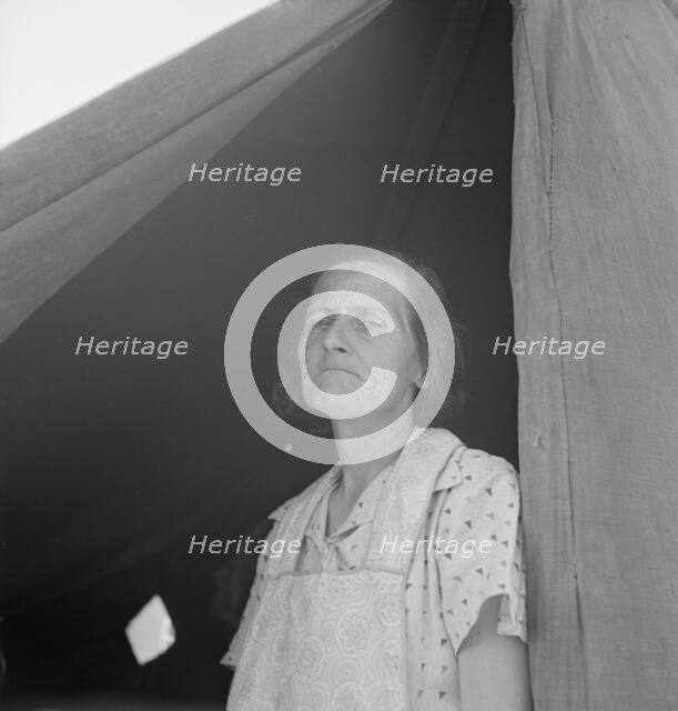 Migrant woman from Arkansas living in contractor's camp near Westley, California, 1939. Creator: Dorothea Lange.
