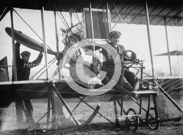 Senorita Lenore Riviero [sic] with Anthony Jannus; In Rex Smith Aeroplane, 1912. Creator: Harris & Ewing.