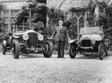WO Bentley standing between two of his cars. Artist: Unknown