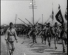 Chinese Soldiers Marching Carrying Flags and Other Equipment, 1920s. Creator: British Pathe Ltd.