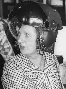 Margaret Thatcher trying on a pilot's helmet, Marconi Avionics Airport Works, 21st August 1978. Artist: Unknown