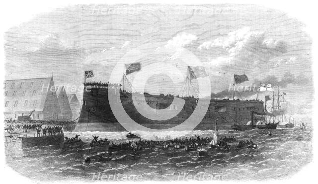 Our Iron-Clad Fleet: floating of Her Majesty's ship Hercules, at Chatham, 1868. Creator: Unknown.