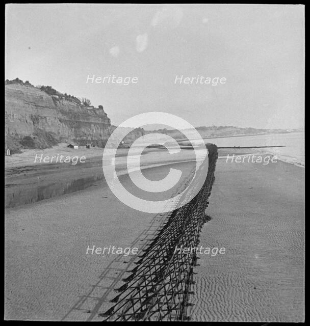 View looking north-east of Shanklin Beach, showing Admiralty scaffolding, Isle Of Wight, 1945. Creator: George R Long.
