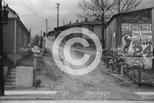 Posters covering a building near Lynchburg to advertise a Downie Bros. circus, 1936. Creator: Walker Evans.