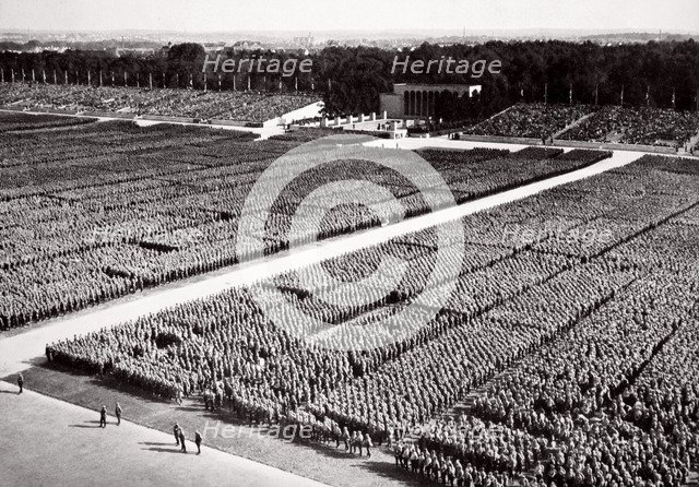 Stormtroopers lined up on parade during a Nazi Party Congress in Nuremberg, Germany, 1936. Artist: Unknown