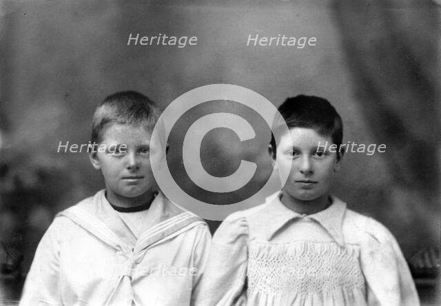 Portrait of two unknown siblings (brother and sister), c1900s. Creator: Robert Augustus Henry L'Estrange.