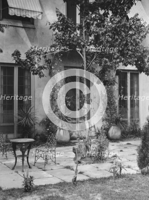 Courtyard, New Orleans or Charleston, South Carolina, between 1920 and 1926. Creator: Arnold Genthe.