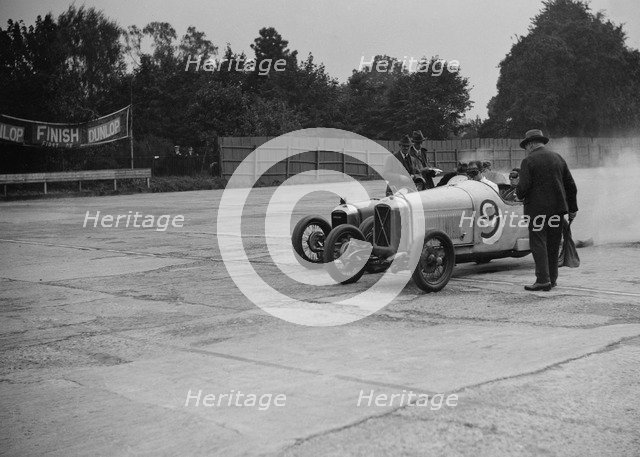 Salmson and Amilcar competing in a race at a Surbiton Motor Club meeting, Brooklands, Surrey, 1928. Artist: Bill Brunell.