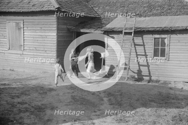 Burroughs children playing in the yard, Hale County, Alabama, 1936. Creator: Walker Evans.
