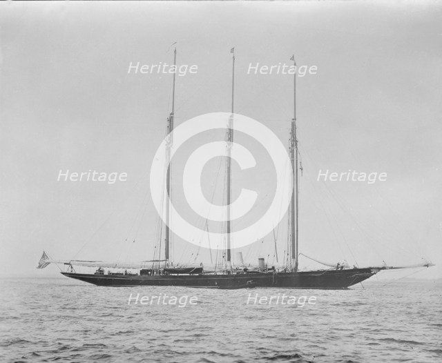 Three masted schooner at anchor. Creator: Kirk & Sons of Cowes.