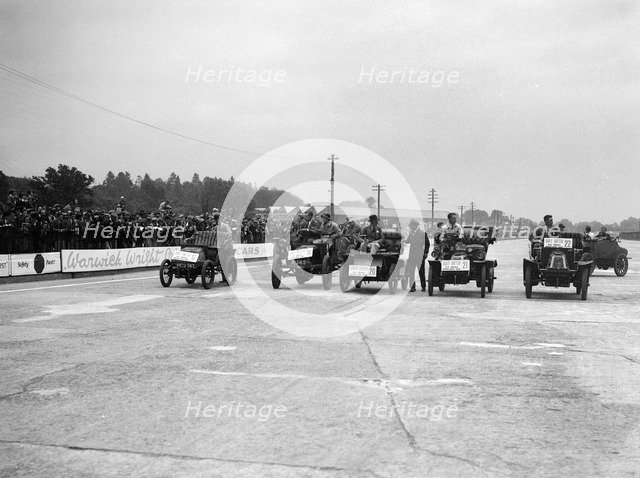 Cars competing in the BARC Daily Sketch Old Crocks Race, Brooklands, 1931. Artist: Bill Brunell.