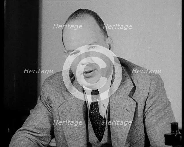 Male American Civilian Giving Expert Analysis in Court During the Lindbergh's Kidnapping Case...1930 Creator: British Pathe Ltd.