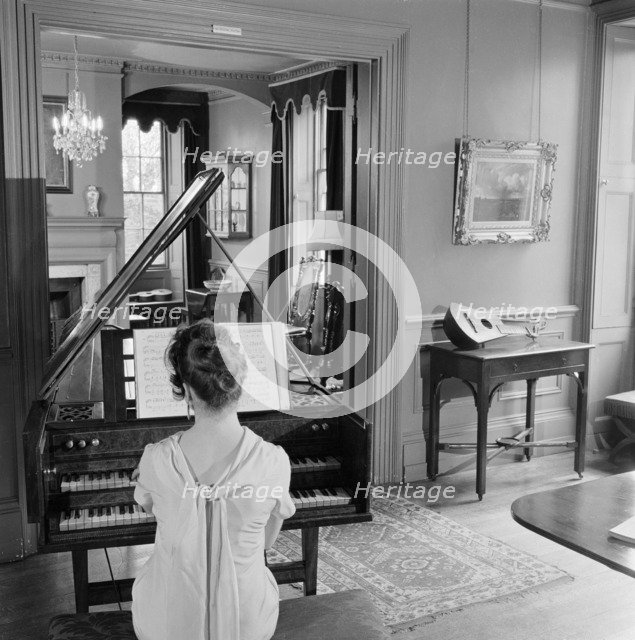 Woman in evening dress playing the harpsichord, Fenton House, London, 1960-1965. Artist: John Gay