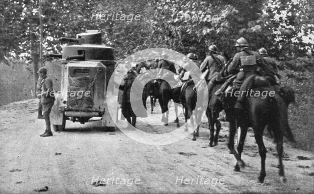 The Dark Hours of Italy; Armored car and cavalry protecting the retreat of a column.., 1917. Creator: Unknown.