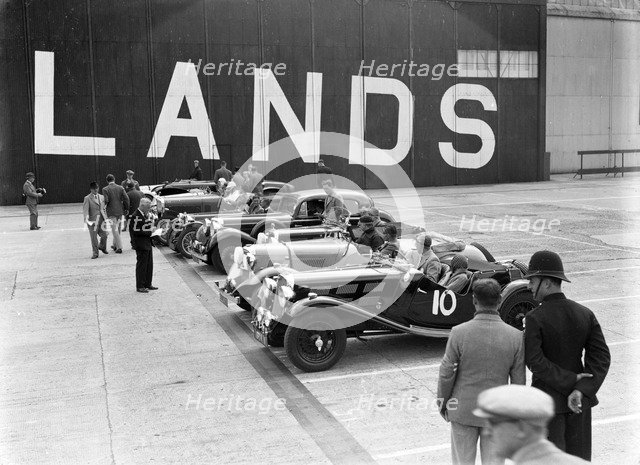 Cars on the start line at the MCC Members Meeting, Brooklands, 10 September 1938. Artist: Bill Brunell.