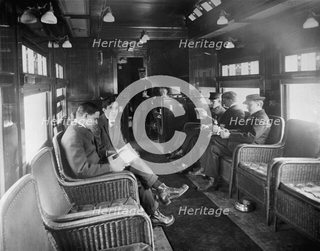 Buffet library car on a deluxe overland limited train, between 1910 and 1920. Creator: William H. Jackson.