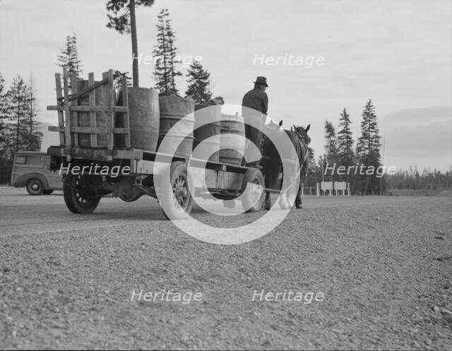 Farmer and his boy hauling water for drinking and domestic purposes..., Boundary County, Idaho, 1939 Creator: Dorothea Lange.