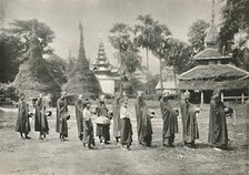 'Burmese Phoongyies Collecting Alms', 1900. Creator: Unknown.