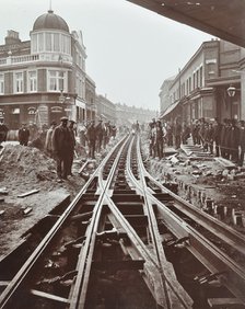 Men working on tramline electricification, Wandsworth, London, 1906. Artist: Unknown.