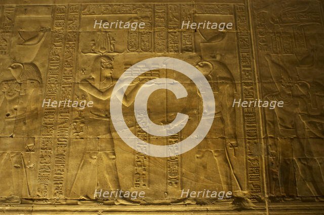 Relief of the Pharaoh making offerings to Horus, Temple of Edfu, Egypt, Ptolemaic period, (2003).  Creator: LTL.