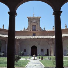 View through a round arch of the courtyard of the former Literary University of Huesca, which tod…