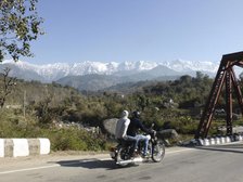 Motorcycle on road near Dhauladar Mountains Himachal Pradesh. Creator: Unknown.