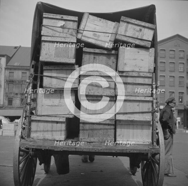 Shipping fish by horse-drawn vehicle from Fulton fish market, New York, 1943. Creator: Gordon Parks.