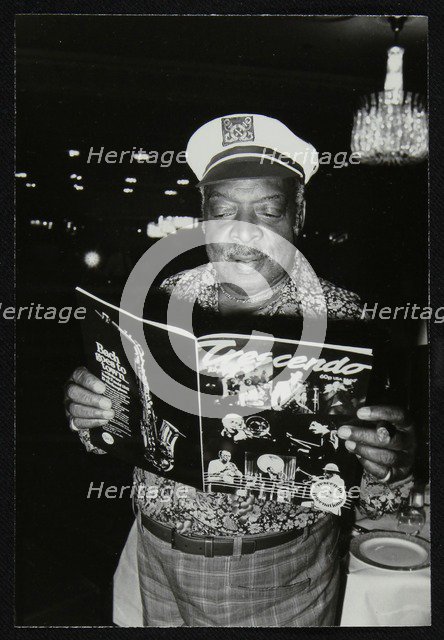 Count Basie reading a copy of Crescendo magazine at the Grosvenor House Hotel, London, 1979. Artist: Denis Williams