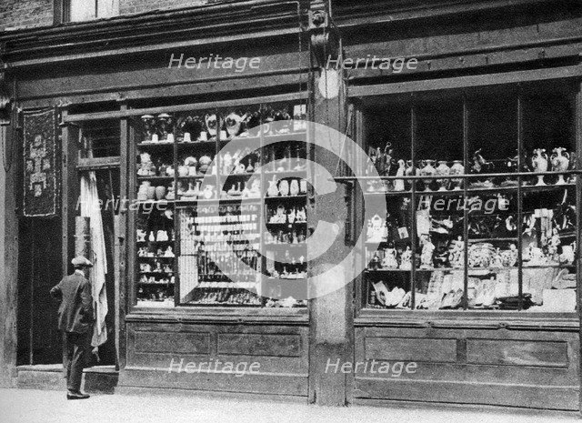 A pawnbroker's shop front, Bow, London, 1926-1927.Artist: Whiffin