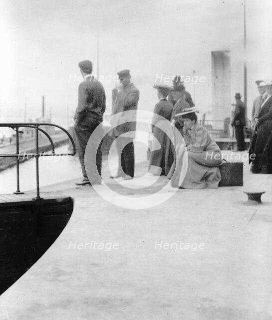 Passengers waiting to board a freighter at the locks at Sault Sainte Marie, Michigan, 1903. Creator: Frances Benjamin Johnston.