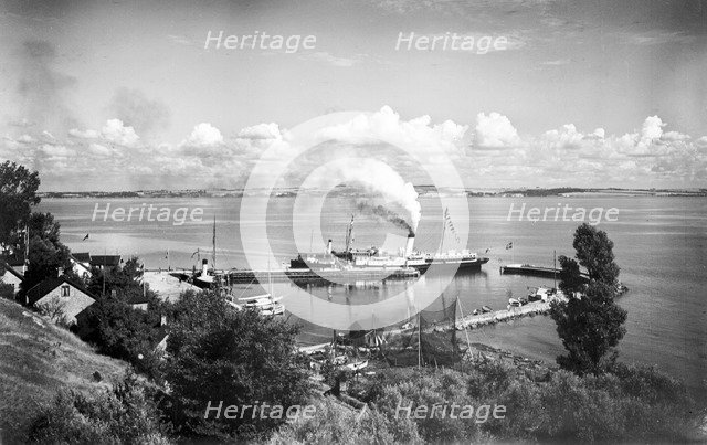 Steamboat in the harbour of Bäckviken, Isle of Ven, Sweden, 1925. Artist: Unknown