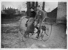 Man and a woman sitting on a double tricycle, England, c1890. Creator: Unknown.